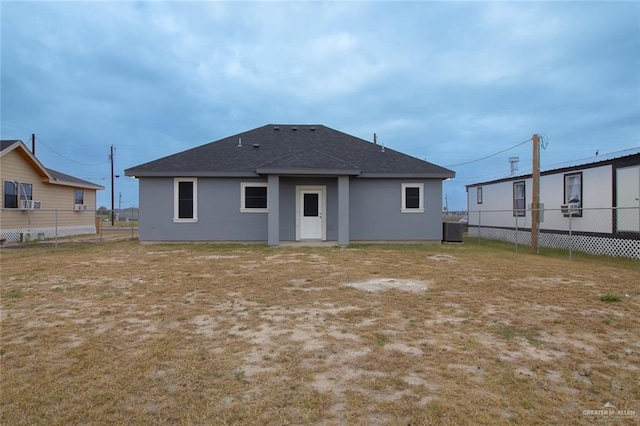 rear view of property featuring central air condition unit