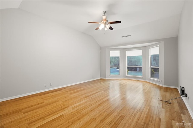 unfurnished room featuring ceiling fan, light hardwood / wood-style floors, and lofted ceiling