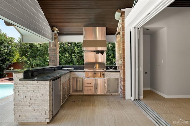 view of patio featuring grilling area and an outdoor kitchen