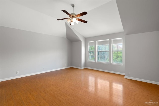 bonus room with ceiling fan, light hardwood / wood-style floors, and vaulted ceiling