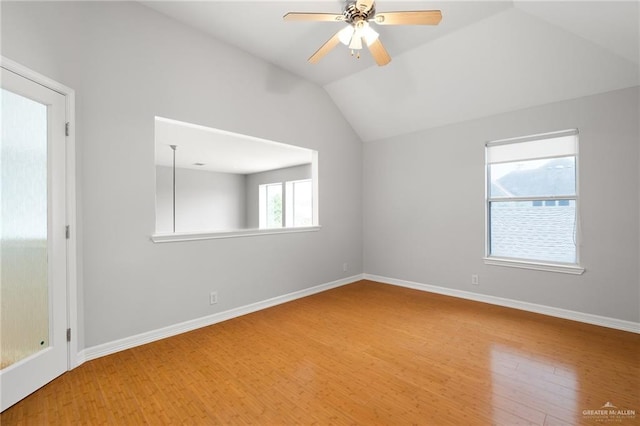 unfurnished room featuring ceiling fan, wood-type flooring, and lofted ceiling