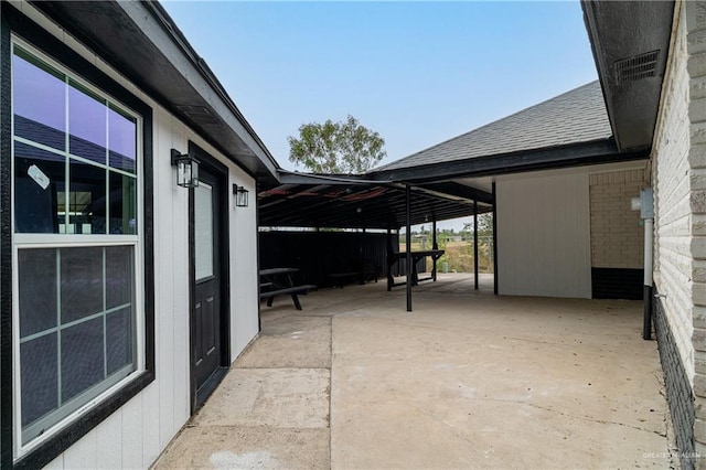 view of patio / terrace with a carport