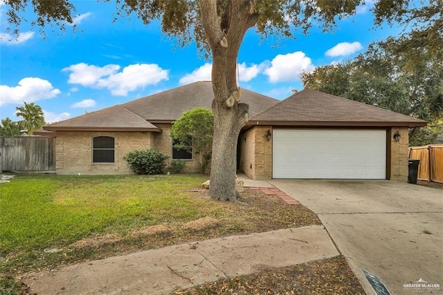 view of front facade featuring a garage and a front lawn