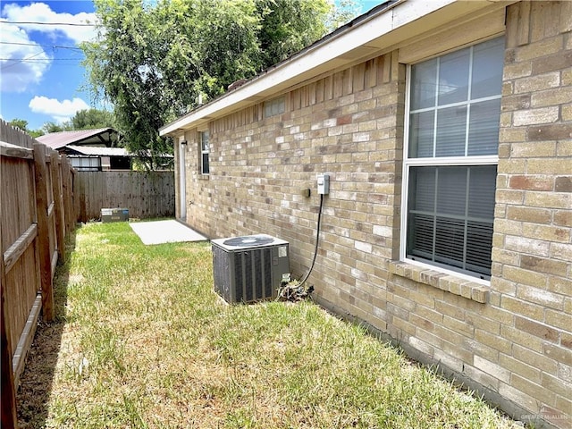 view of yard featuring central AC