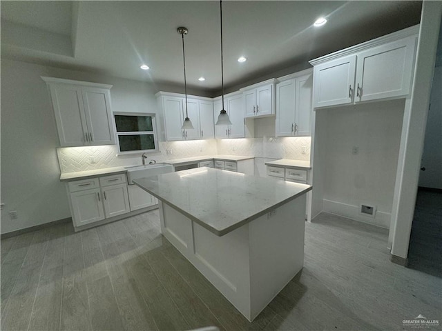 kitchen with white cabinets and a center island