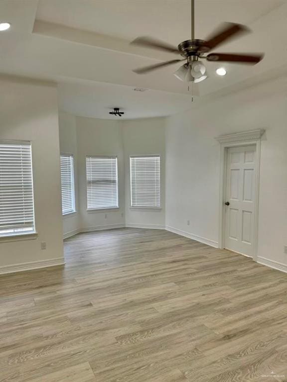 spare room with ceiling fan and light hardwood / wood-style floors