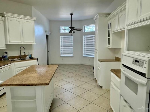 kitchen with ceiling fan, white cabinetry, white appliances, and sink