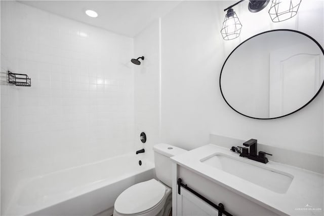 full bathroom featuring toilet, vanity, and tiled shower / bath combo