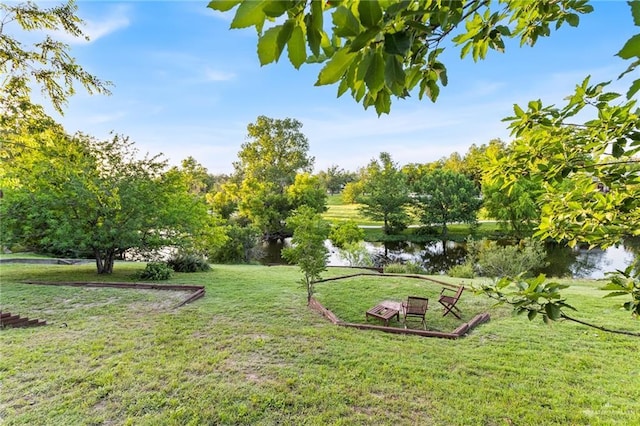 136 W Evergreen St, Boerne, TX 78006 - view of green lawn featuring a water view