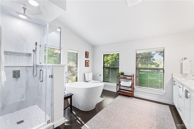 136 W Evergreen St, Boerne, TX 78006 - bathroom featuring vanity, a marble finish shower, lofted ceiling, a soaking tub, and wood finished floors