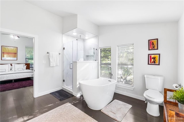 136 W Evergreen St, Boerne, TX 78006 - ensuite bathroom with a shower stall, a freestanding bath, and wood finished floors