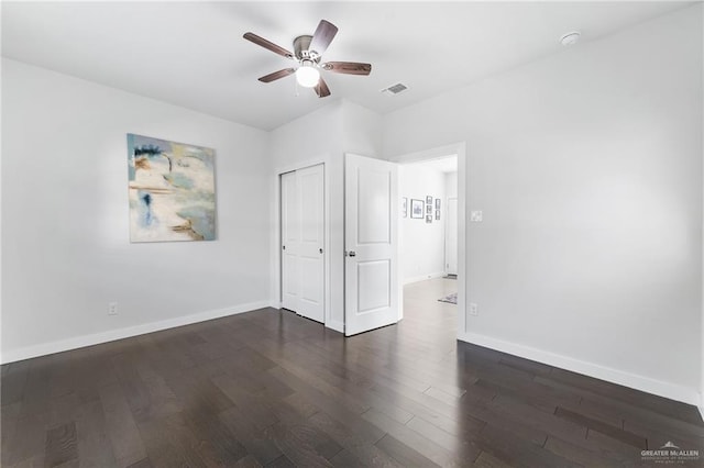 136 W Evergreen St, Boerne, TX 78006 - unfurnished bedroom featuring wood finished floors, a closet, and ceiling fan
