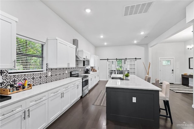 136 W Evergreen St, Boerne, TX 78006 - kitchen with stainless steel appliances, plenty of natural light, white cabinetry, backsplash, and recessed lighting