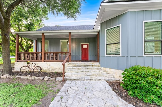 136 W Evergreen St, Boerne, TX 78006 - entrance to property with board and batten siding, a porch, and a shingled roof