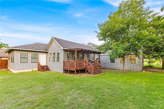 136 W Evergreen St, Boerne, TX 78006 - back of property featuring a wooden deck, board and batten siding, and a lawn