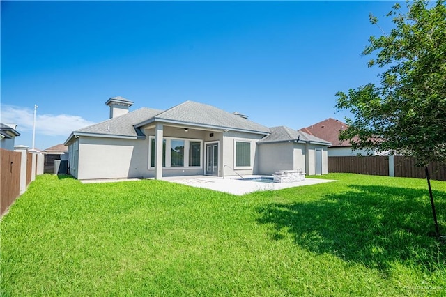 13809 N 37th St, Mcallen, TX 78504 - back of property with a patio area, stucco siding, and roof with shingles
