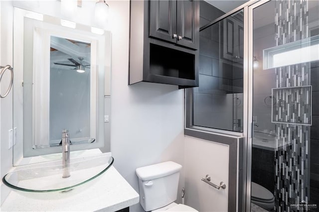 13809 N 37th St, Mcallen, TX 78504 - full bathroom featuring toilet, a shower stall, vanity, and ceiling fan