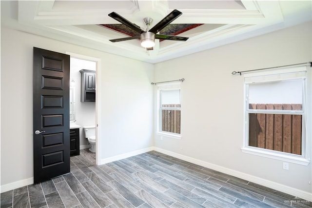 13809 N 37th St, Mcallen, TX 78504 - unfurnished bedroom with a raised ceiling, baseboards, wood tiled floors, ensuite bath, and ceiling fan