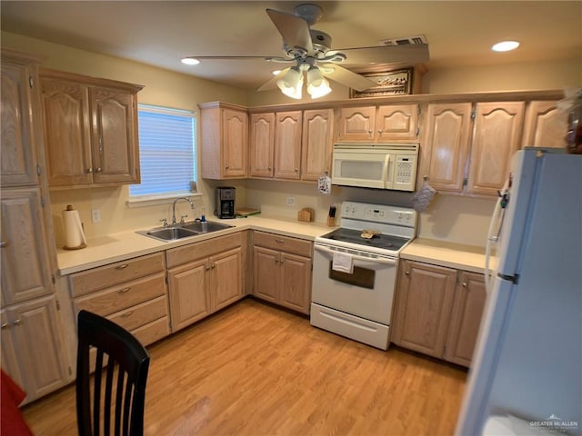 14022 Whitewing Ln, Lyford, TX 78569 - kitchen with white appliances, a sink, light brown cabinets, ceiling fan, and light countertops