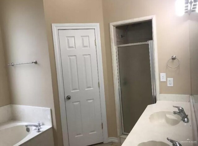 bathroom with plus walk in shower and vanity