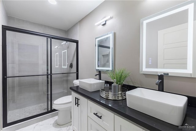 1710 W B St, Mission, TX 78572 - full bathroom with marble look tile flooring, toilet, double vanity, and a stall shower