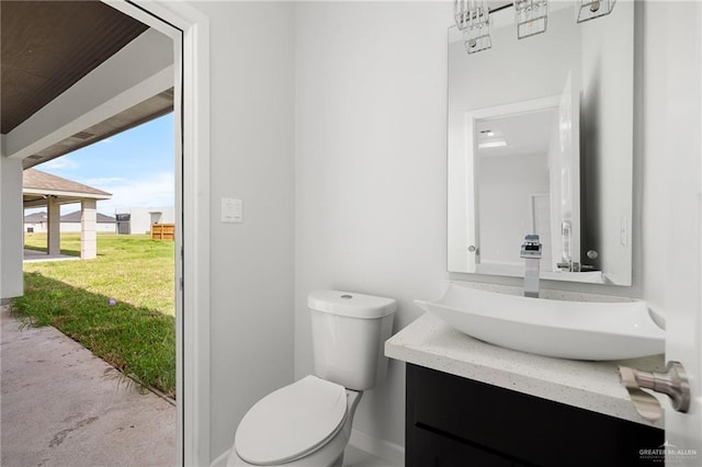 bathroom featuring vanity and toilet