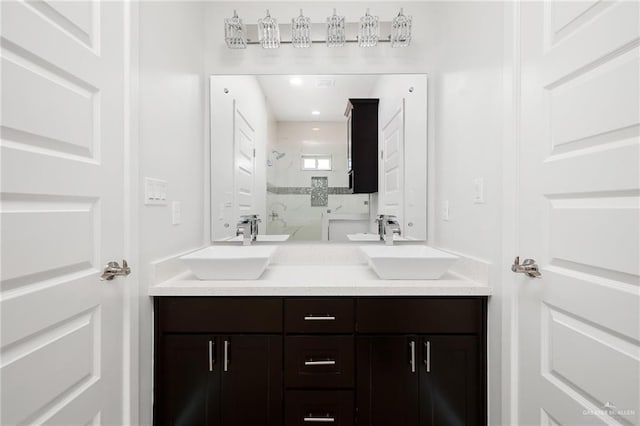 bathroom with vanity and a shower with shower door