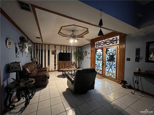 tiled living room featuring french doors and ceiling fan