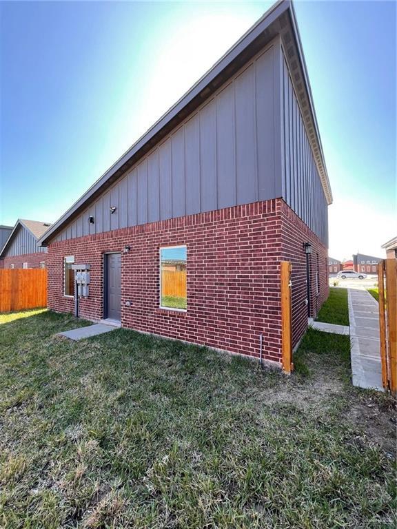 view of home's exterior with a lawn