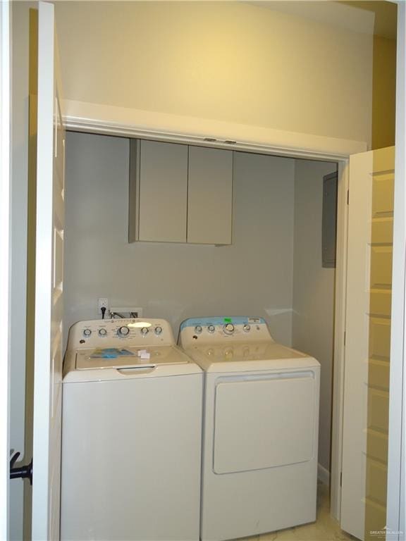 clothes washing area with washer and clothes dryer