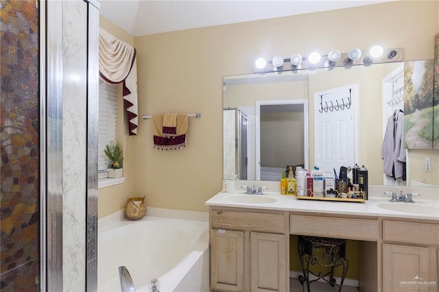 bathroom featuring vanity and shower with separate bathtub