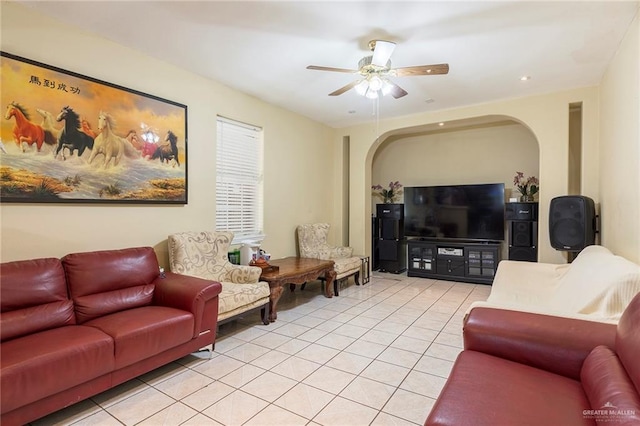 living room featuring ceiling fan and light tile patterned flooring