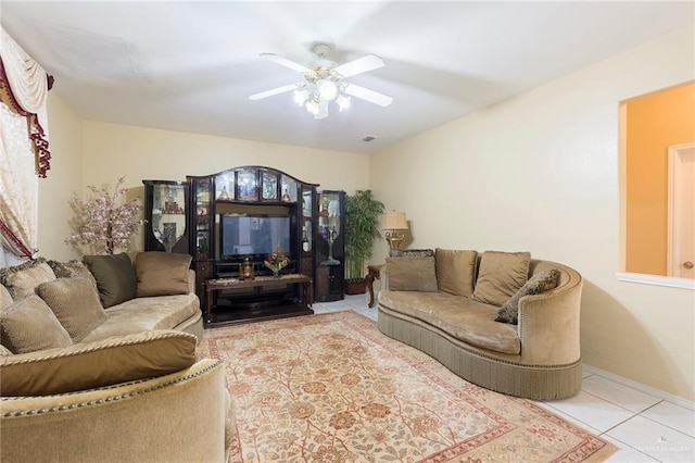 tiled living room featuring ceiling fan