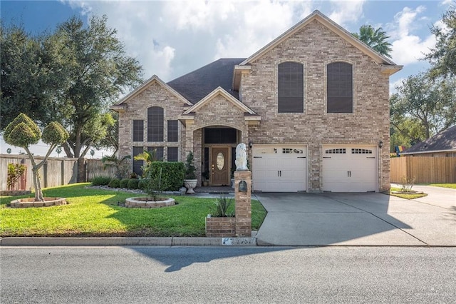 view of front of property with a garage and a front lawn