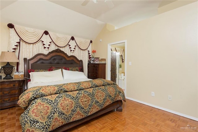 bedroom with parquet flooring, ensuite bath, ceiling fan, and lofted ceiling