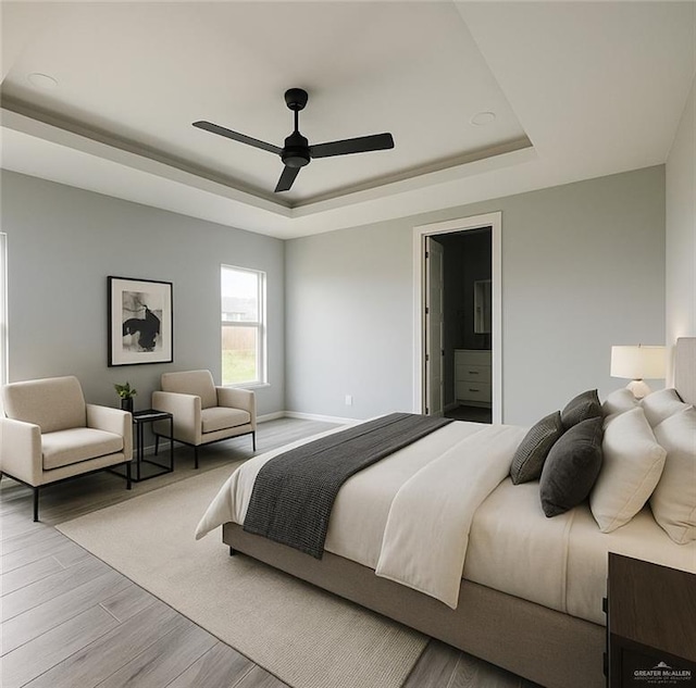 502 Pearl St, Edinburg, TX 78542 - bedroom featuring a raised ceiling, wood finished floors, ceiling fan, and baseboards
