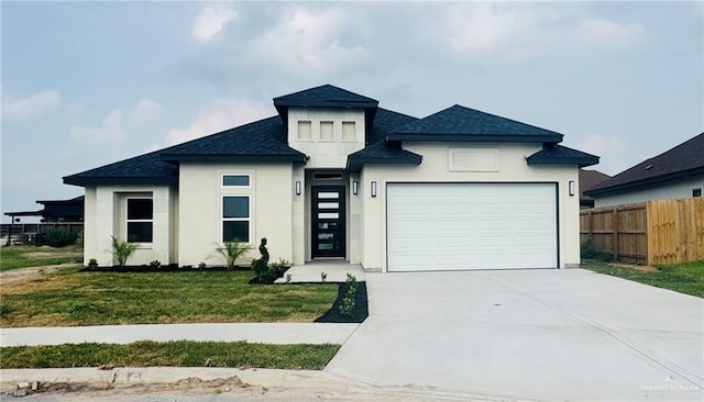502 Pearl St, Edinburg, TX 78542 - view of front of property with a shingled roof, a garage, stucco siding, and driveway