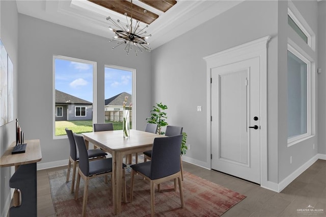 1101 Magnolia St, Mission, TX 78573 - dining area featuring a chandelier, baseboards, and wood finished floors