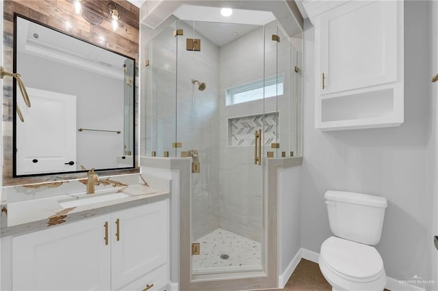 1101 Magnolia St, Mission, TX 78573 - full bathroom with a shower stall, toilet, vanity, and baseboards