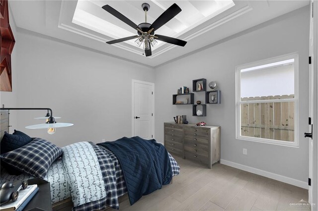 1101 Magnolia St, Mission, TX 78573 - bedroom with baseboards, a ceiling fan, and a raised ceiling