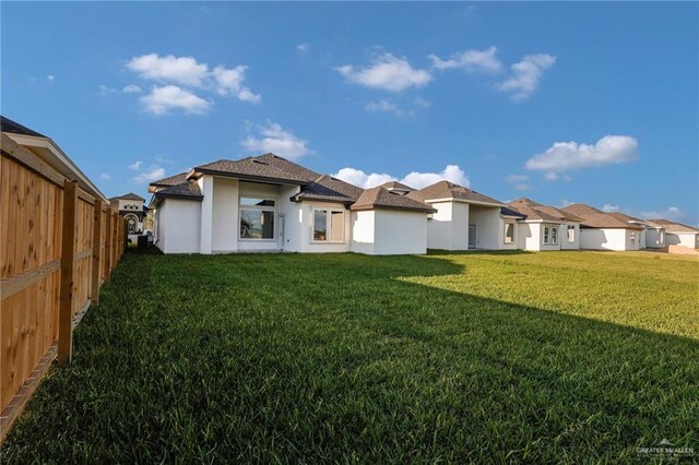 1101 Magnolia St, Mission, TX 78573 - back of house with stucco siding