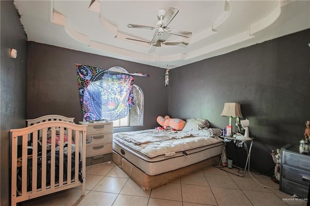 1722 Blue Bird Ave, Penitas, TX 78576 - tiled bedroom with a tray ceiling and a ceiling fan