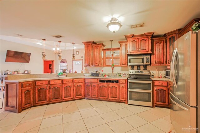 1722 Blue Bird Ave, Penitas, TX 78576 - kitchen with stainless steel appliances, light countertops, a peninsula, pendant lighting, and light tile patterned floors