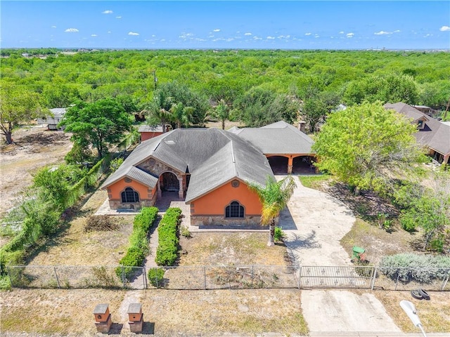 1722 Blue Bird Ave, Penitas, TX 78576 - view of subject property with a heavily wooded area
