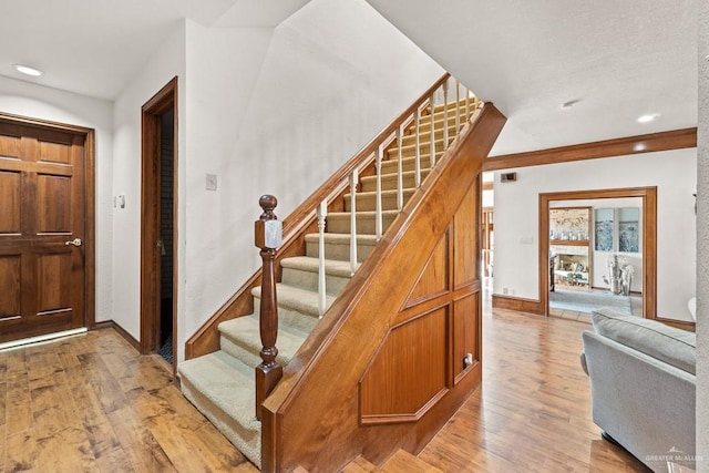 4301 Spring Creek Dr, Corpus Christi, TX 78410 - foyer entrance with stairs, light wood finished floors, baseboards, and recessed lighting