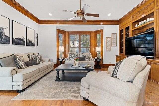 4301 Spring Creek Dr, Corpus Christi, TX 78410 - living area featuring ornamental molding, ceiling fan, built in features, light wood-type flooring, and recessed lighting