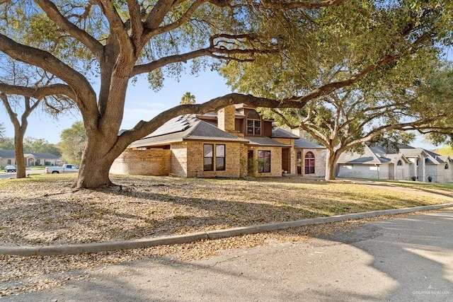 4301 Spring Creek Dr, Corpus Christi, TX 78410 - view of front of property with solar panels and brick siding