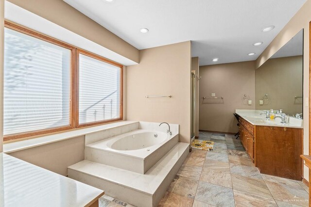 4301 Spring Creek Dr, Corpus Christi, TX 78410 - bathroom with vanity, a whirlpool tub, recessed lighting, and a stall shower