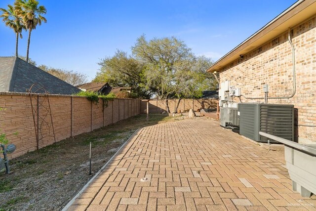 4301 Spring Creek Dr, Corpus Christi, TX 78410 - fenced backyard featuring a patio area and central AC