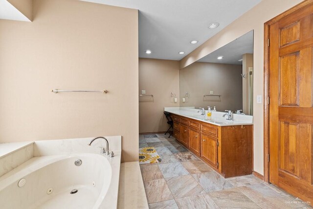 4301 Spring Creek Dr, Corpus Christi, TX 78410 - full bathroom with a jetted tub, recessed lighting, double vanity, and stone finish floors